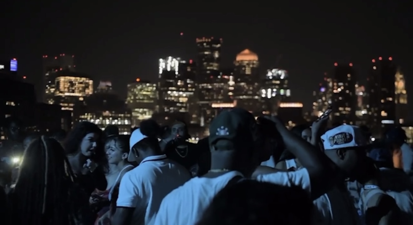 Nighttime party with a view of the Boston skyline